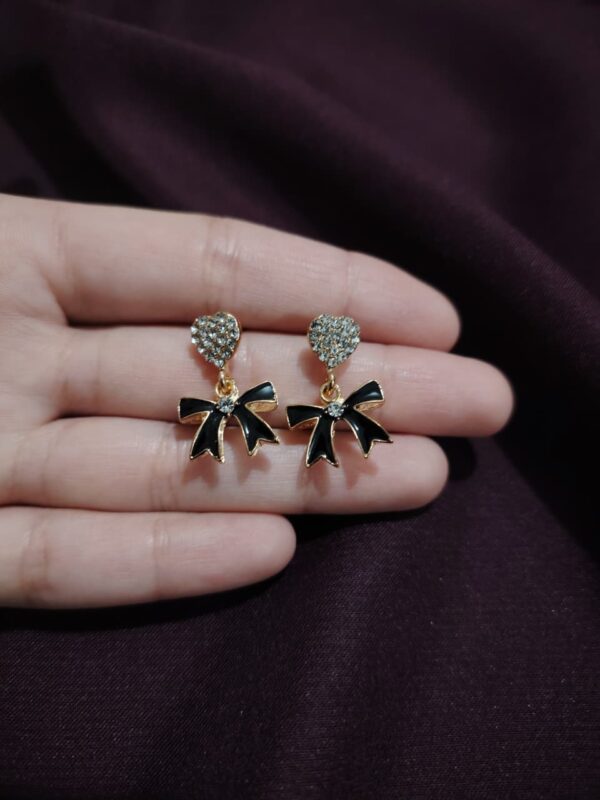 Heart and bow stud earrings - Image 2